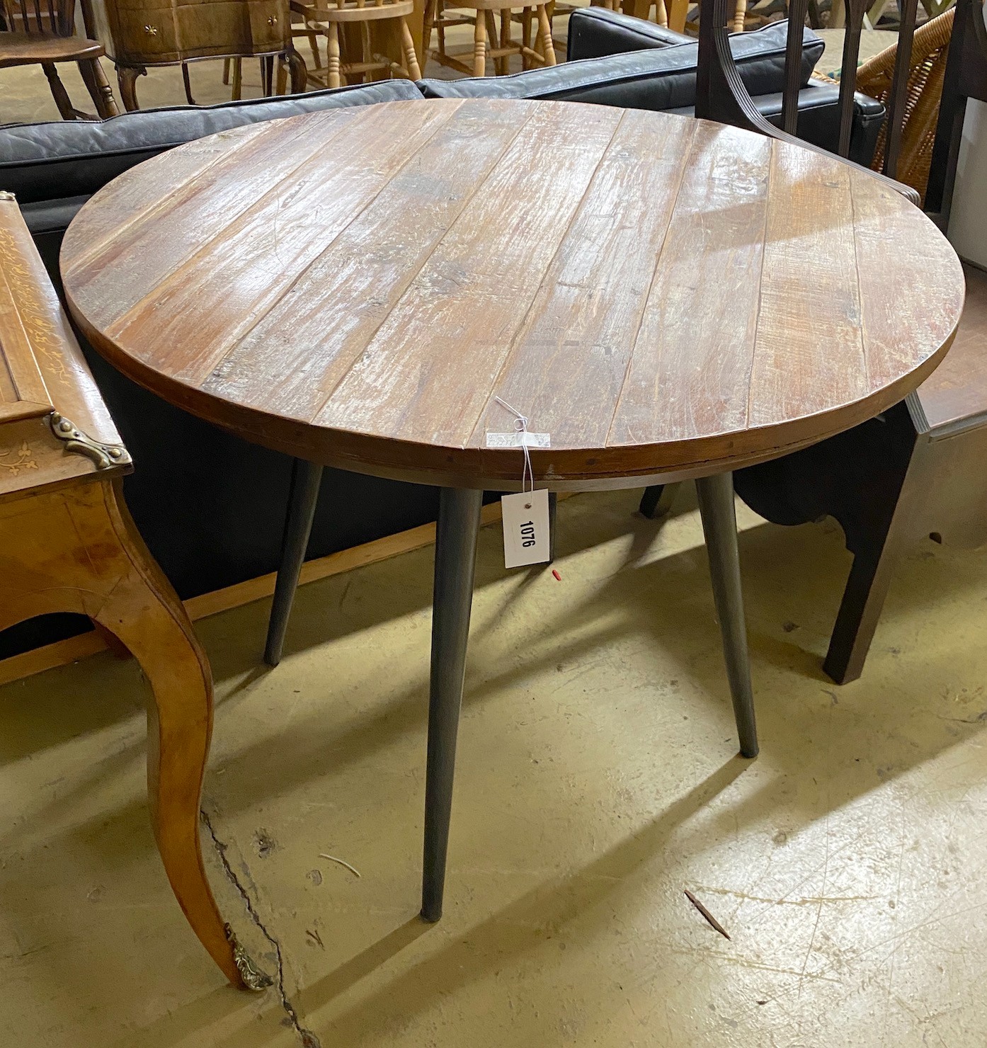 A teak top circular table with metal underframe, diameter 91cm, height 74cm